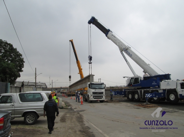 A Cunzolo realizou o i�amento de 02 vigas de 30 metros de comprimento, 1,20 metros de largura e peso de 30 toneladas cada. Para essa opera��o foram utilizados 01 Guindaste Rodovi�rio Tadano ATF 220 (cap. 220 t.), 01 Guindaste Rodovi�rio Liebherr 220 (cap. 220 t.) e 02 carretas Dolly.
